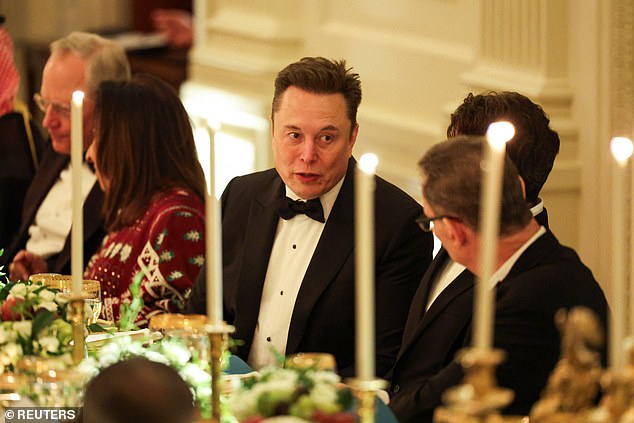 Elon Musk speaks with Pfizer CEO Albert Bourla at a White House dinner honoring Saudi Crown Prince Mohammed bin Salman
