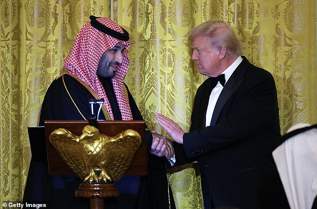 Saudi Crown Prince Mohammed bin Salman shakes hands with President Donald Trump at the White House