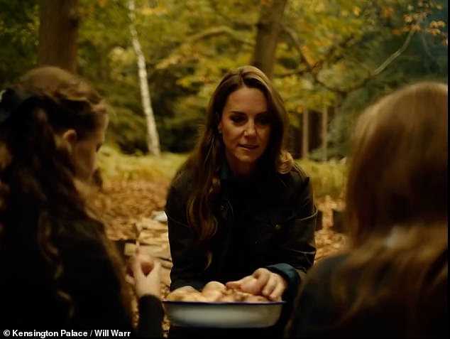 Princess Kate bakes simple bread over a campfire and plays with children in the autumn Mother Nature film.