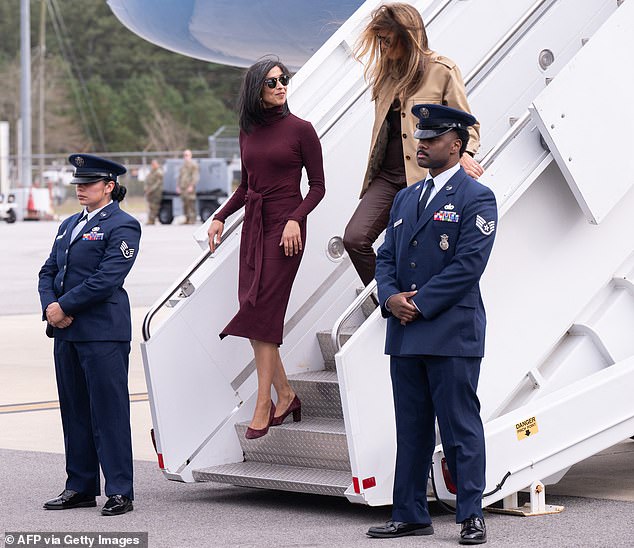 Melania Trump and Usha Vance arrive at Camp Lejeune in coordinated fall looks.
