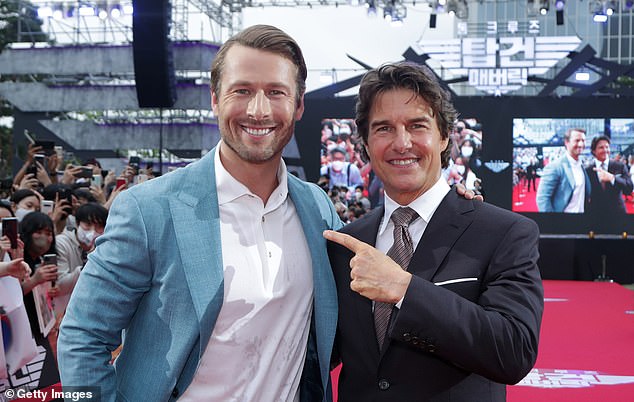Glen Powell and Tom Cruise together in 2022 amid talk of Powell as the 'next Tom Cruise'.