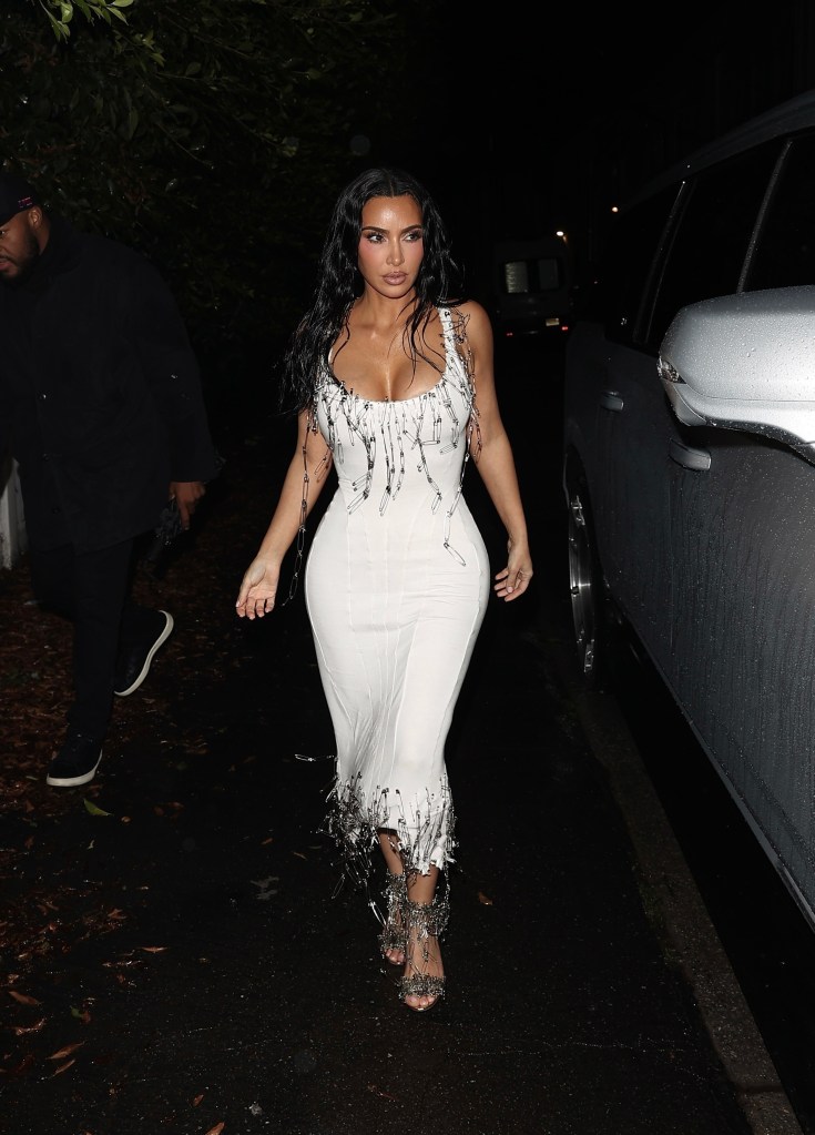 Kim Kardashian in a white Dilara Findikoglu safety pin dress arriving at Petra Collins' L.A. party.