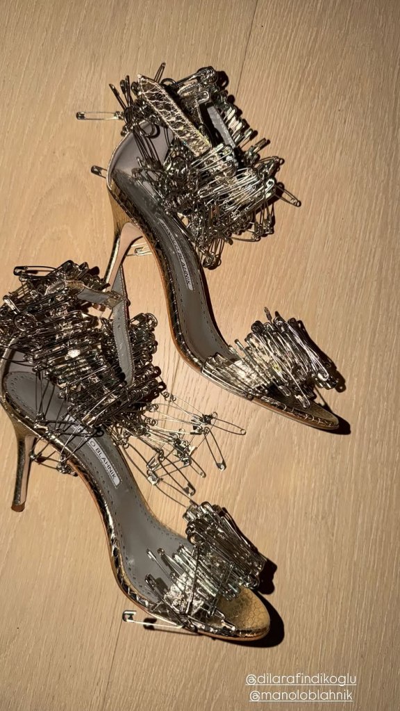 Close-up of Kim Kardashian's Dilara Findikoglu x Manolo Blahnik safety pin sandals.