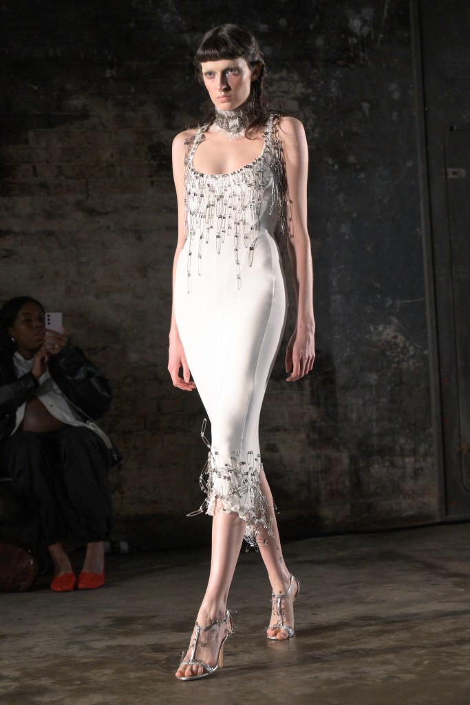 Runway model wearing the Dilara Findikoglu safety pin dress at the Fall/Winter 2025 show.