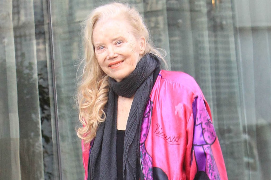 Actress Sally Kirkland smiling in a pink jacket.