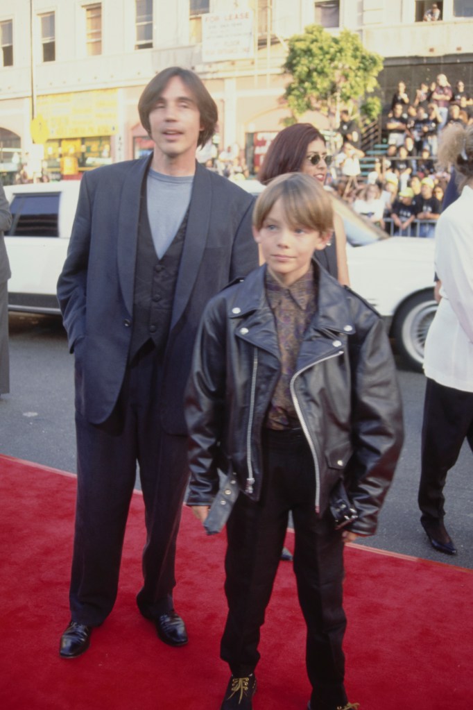 Jackson Browne and a young Ethan Browne at a Hollywood premiere in the early 1990s.