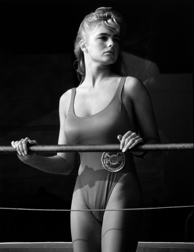 Erika Eleniak as Baywatch lifeguard Shauni McClain in a swimsuit, early 1990s publicity portrait.