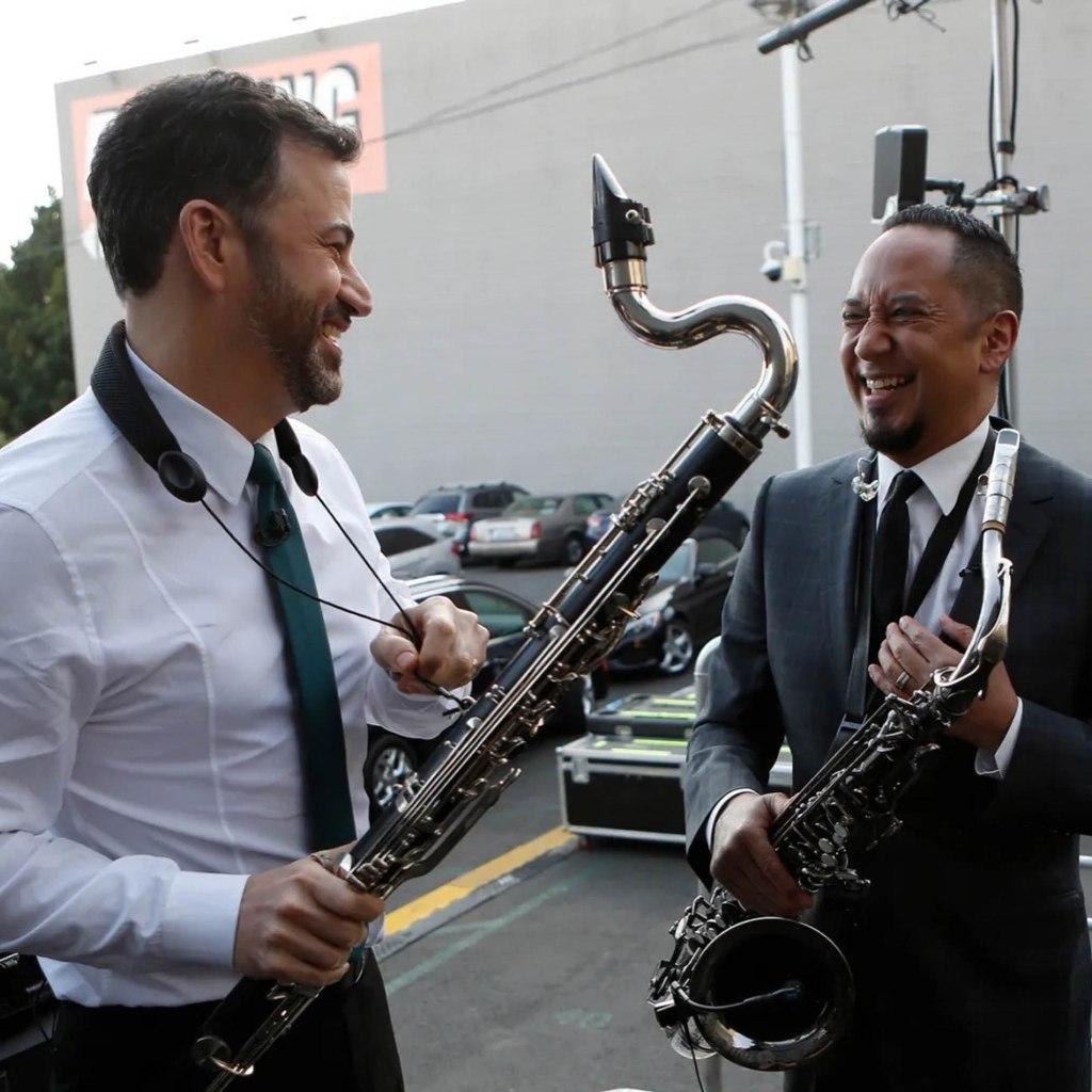 Jimmy Kimmel and Cleto Escobedo III share a light moment with their instruments.