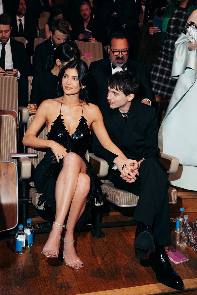 Kylie Jenner and Timothee Chalamet sitting together and holding hands at the EE BAFTA Film Awards 2025.
