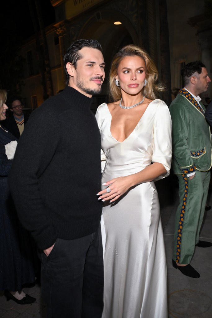 Gleb Savchenko and Brooks Nader posing at 'The White Lotus' Season 3 Los Angeles Premiere.