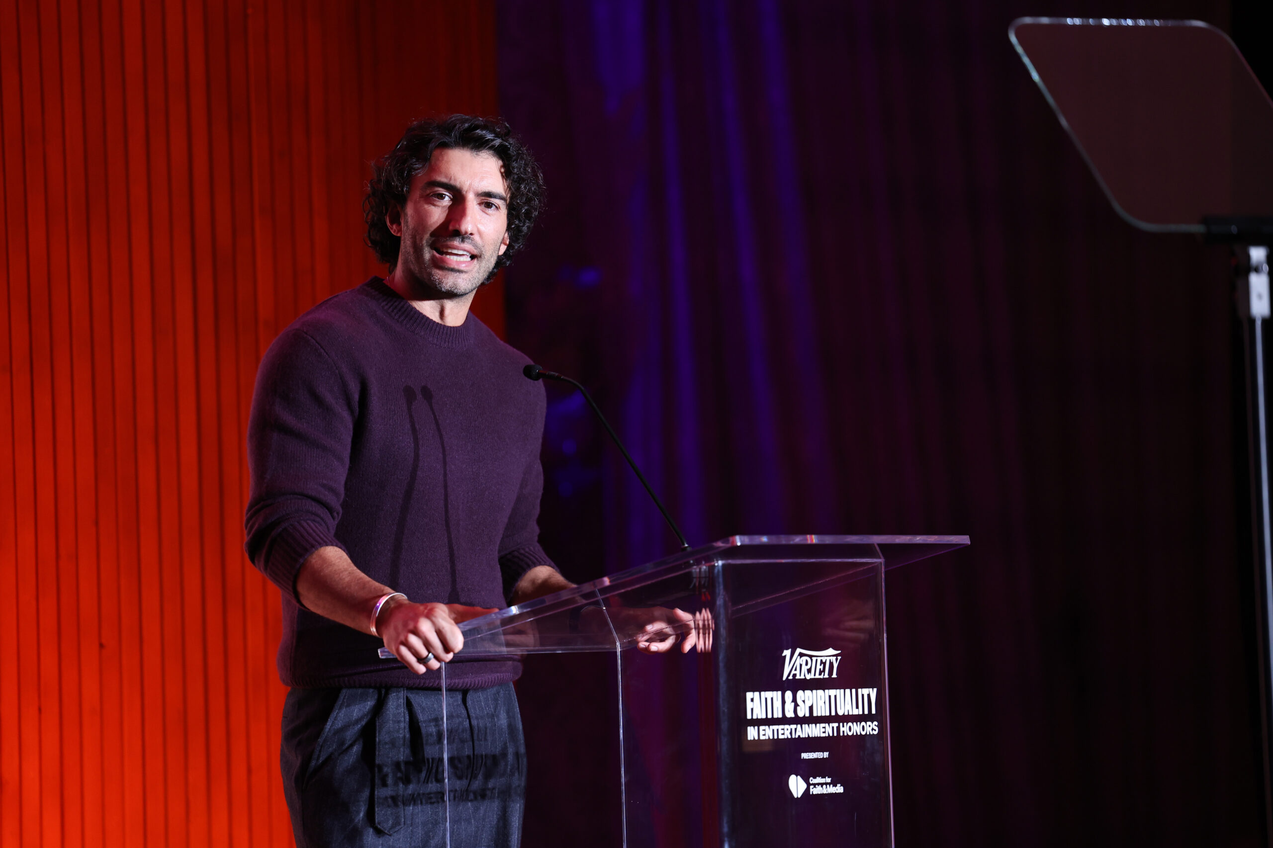 Justin Baldoni speaking onstage at a Variety event amid the ongoing legal dispute.
