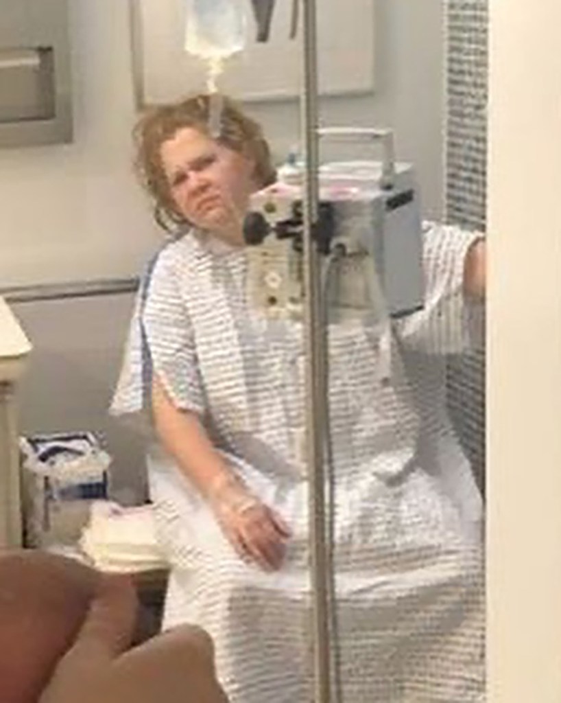 Amy Schumer in a hospital gown with an IV drip, the unflattering snap she shared to make her point.