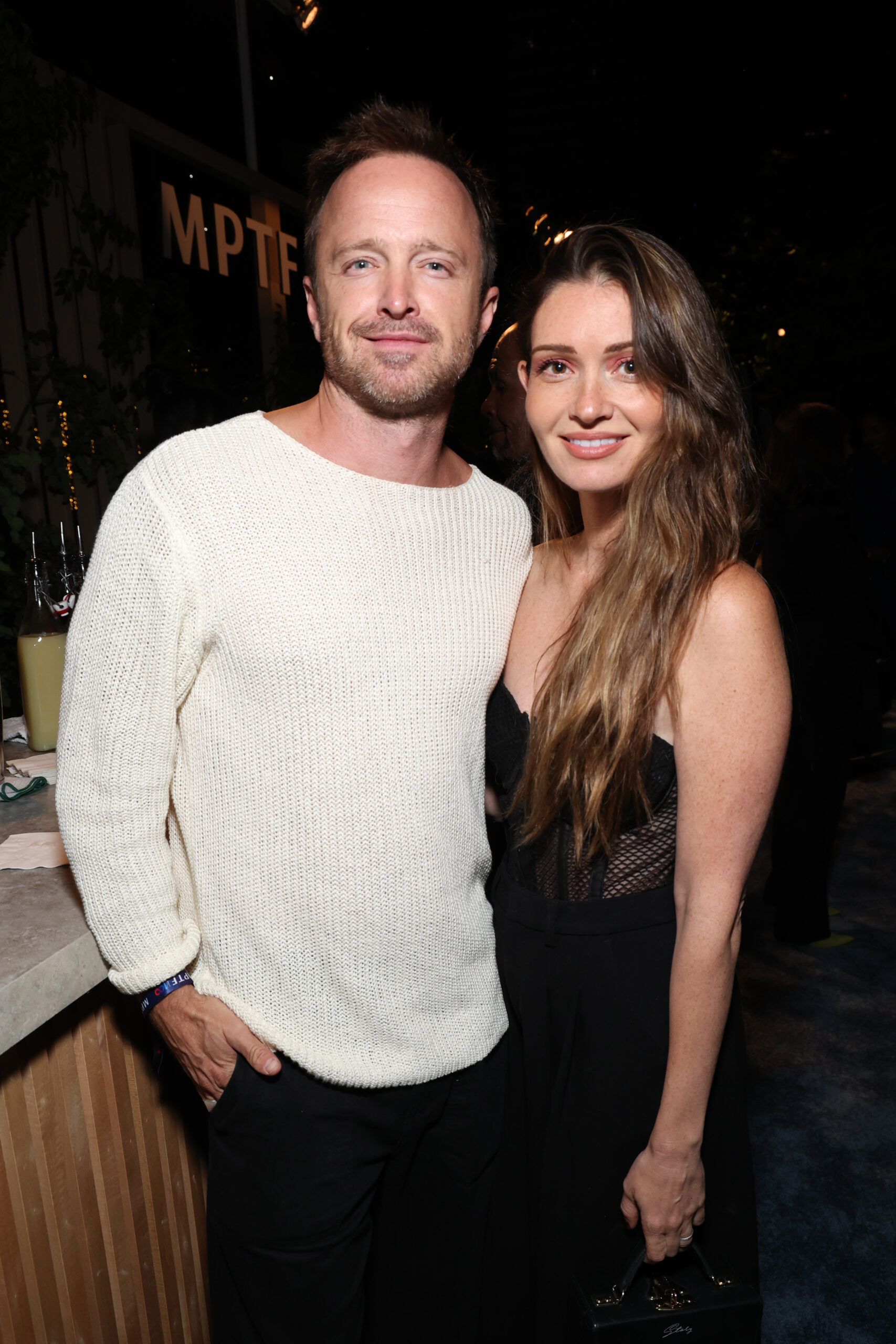 Aaron Paul and Lauren Parsekian smiling for a photo.