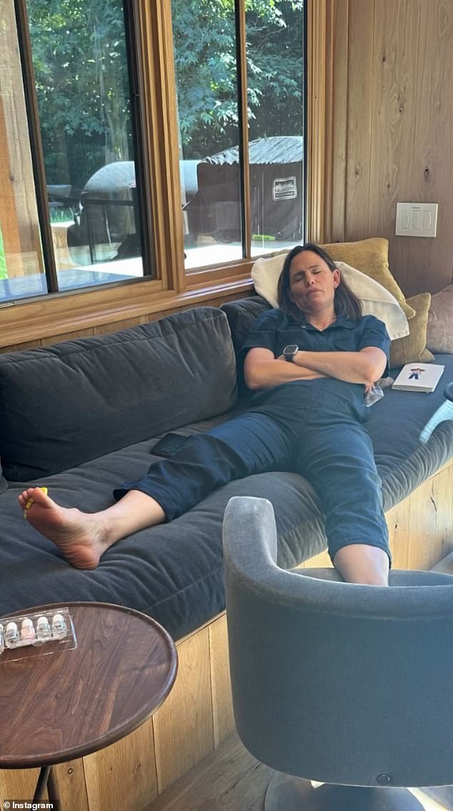 Jennifer Garner napping on a couch, one of the candid shots from the video.