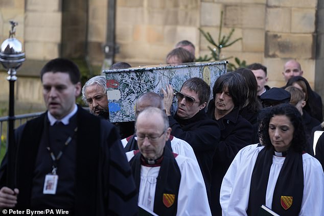 Liam Gallagher with Stone Roses bandmates John Squire and Alan 'Reni' Wren carrying Mani's coffin