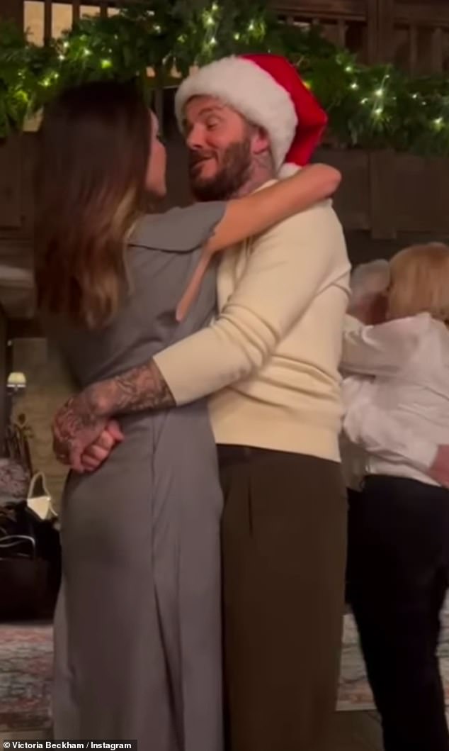 Victoria and David Beckham pose for a Christmas photo at their Cotswolds home