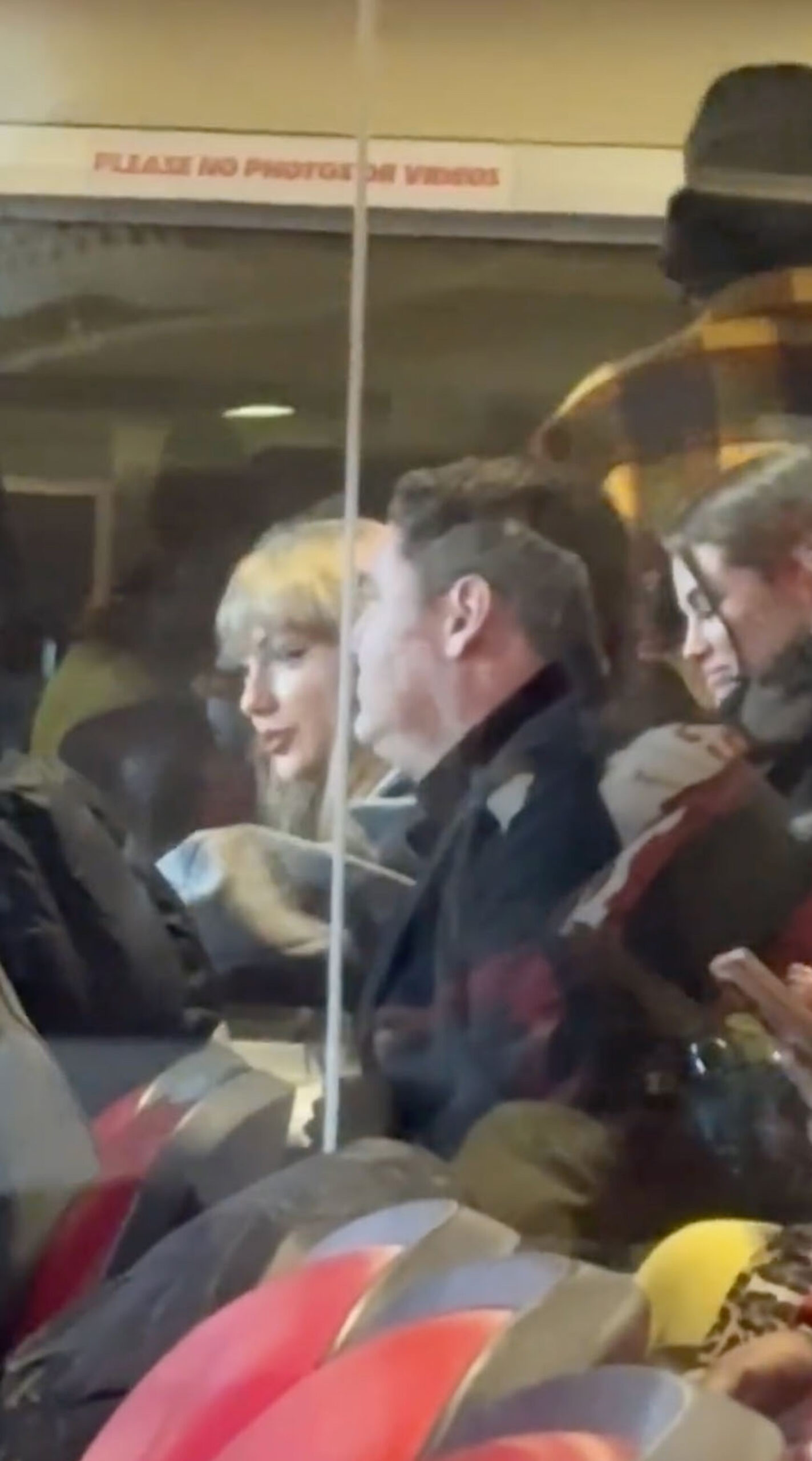 Leonardo DiCaprio, in a black puffer jacket and cap, seen in the same suite during the Chiefs game.