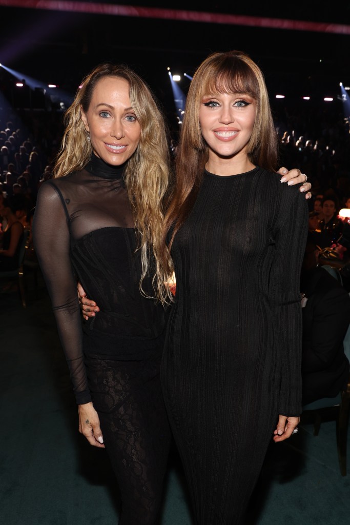 Tish Cyrus and Miley Cyrus pose for a photo at the 67th Annual Grammy Awards.