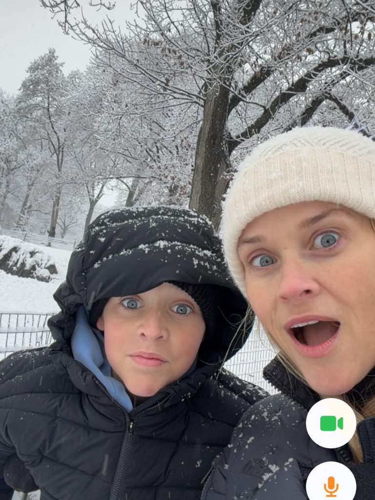 Reese Witherspoon and her son, Tennessee, looking surprised in the snow.