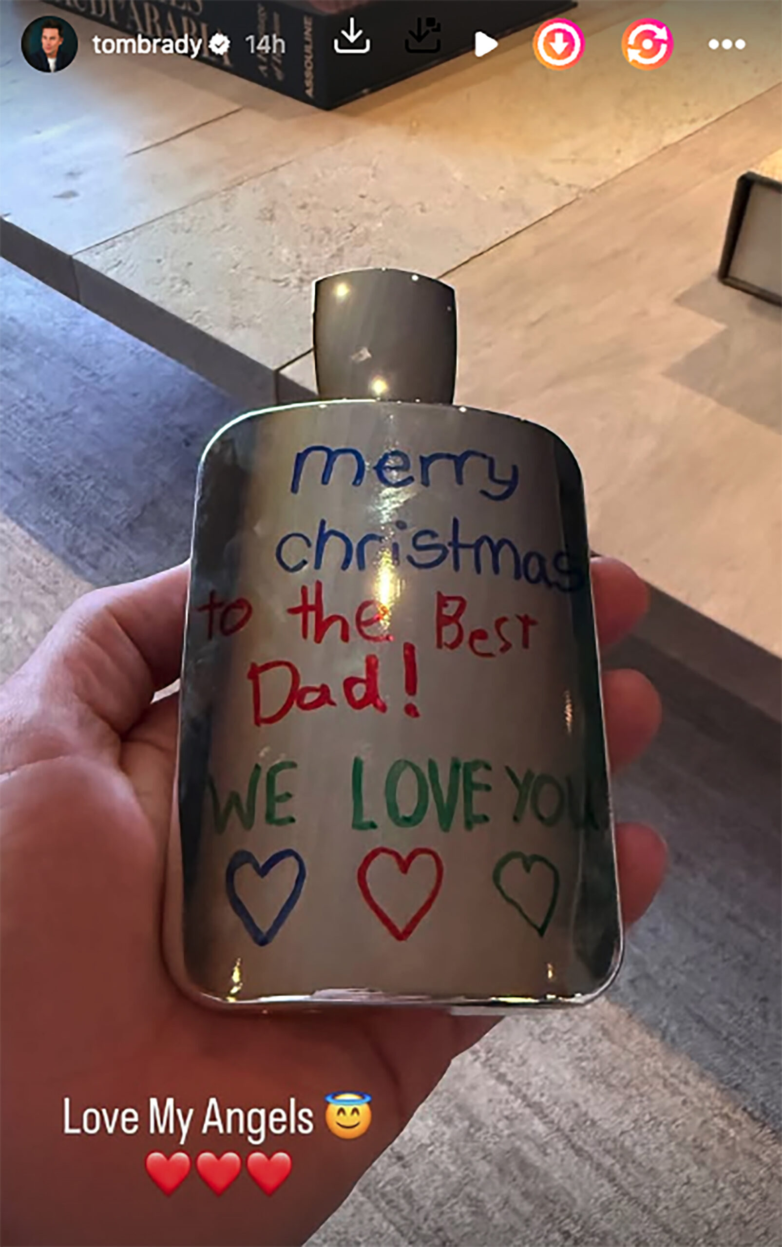Handmade gift reading "merry christmas to the Best Dad! WE LOVE YOU" shared on Tom Brady's Instagram Story.