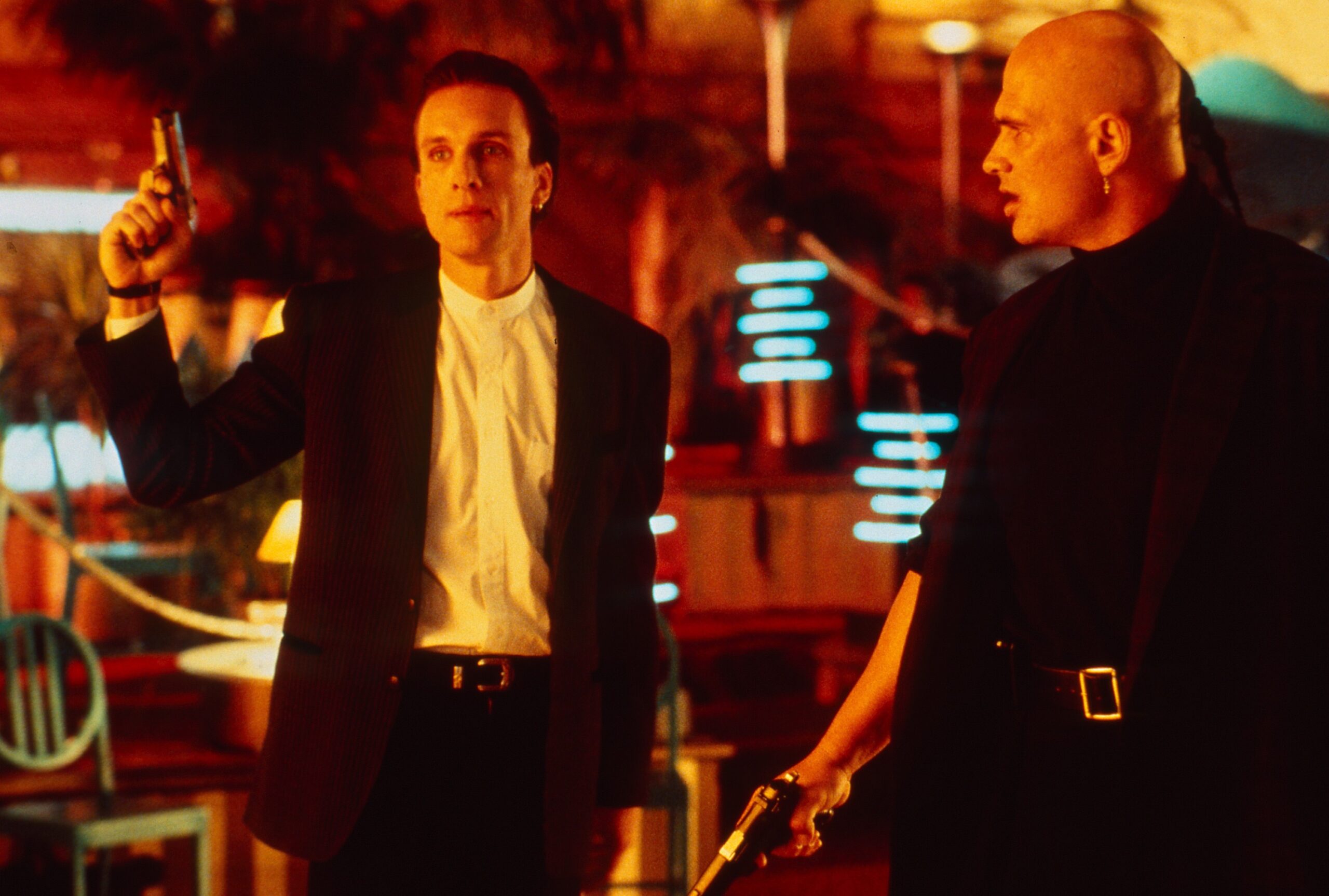 Peter Greene as Dorian Tyrell in The Mask (1994), holding a gun. Courtesy of New Line Cinema.