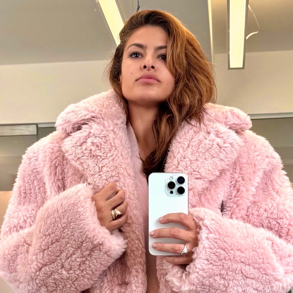 Eva Mendes in a pink Stella McCartney coat.
