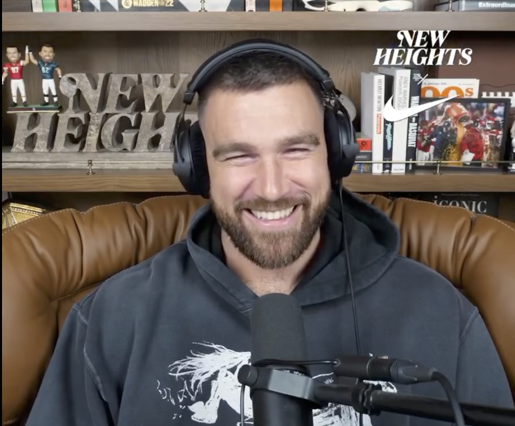 Travis Kelce laughing on the New Heights podcast after repeating that he and Taylor Swift 'don't fight.'