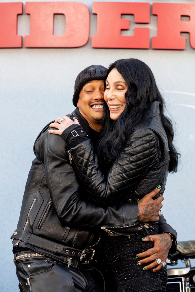 Cher and Alexander "AE" Edwards embrace at The Bikeriders premiere. (WireImage)