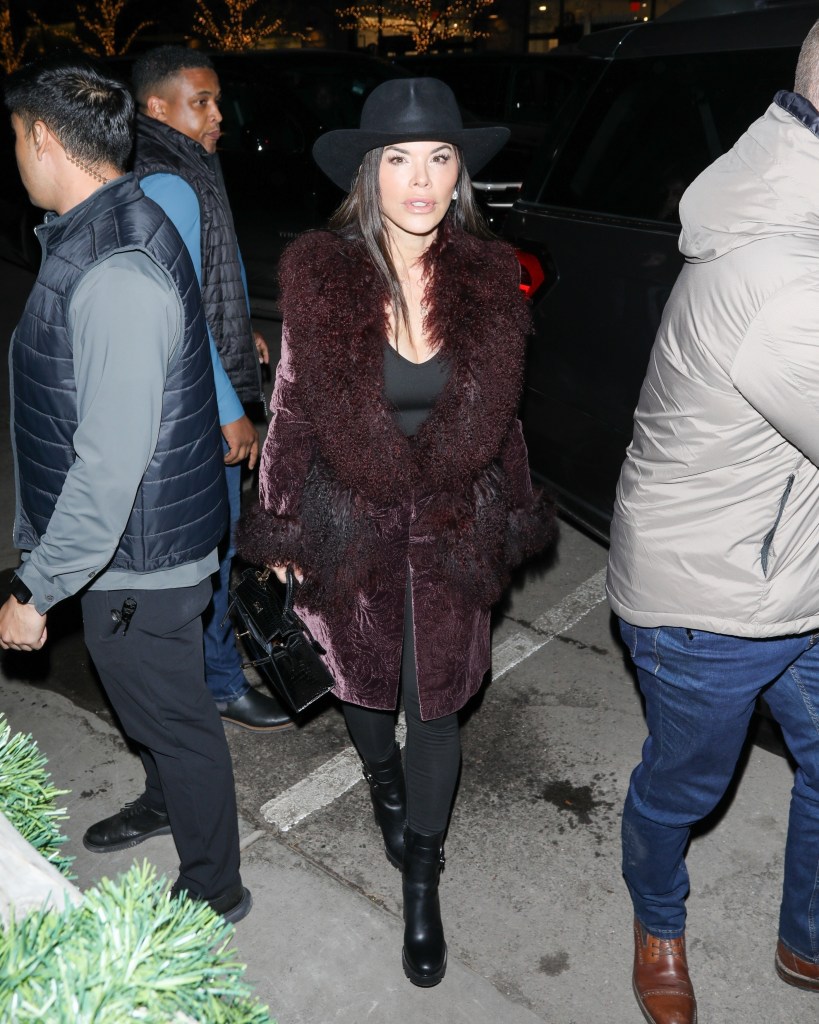 Lauren Sanchez arriving at Kemo Sabe in Aspen in an all-black outfit with a statement maroon coat.
