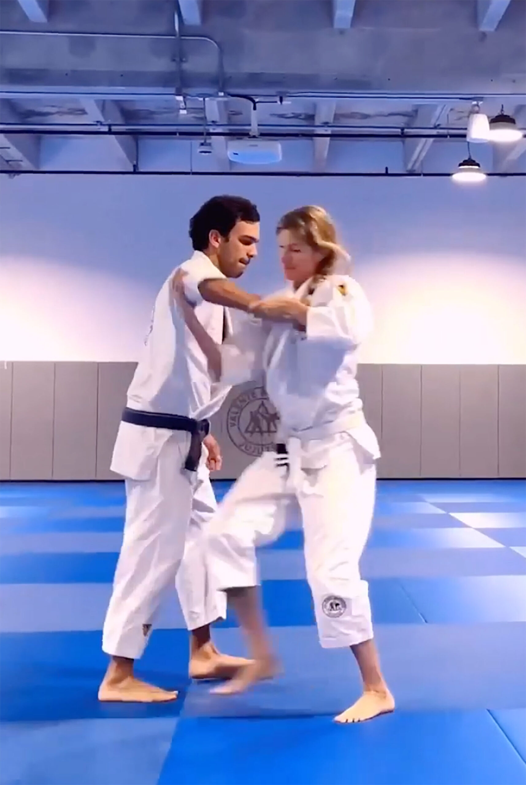 Gisele Bundchen practicing jiu-jitsu with instructor Joaquim Valente.