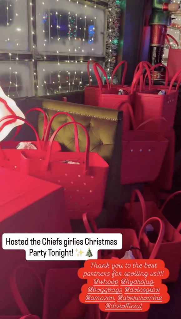Red gift bags with merchandise from various brands at the "Chiefs girlies Christmas Party."