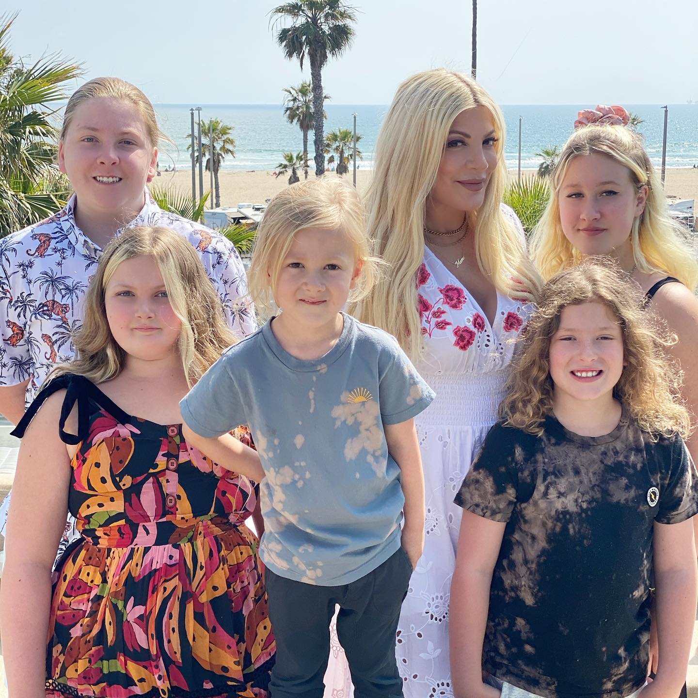 Tori Spelling with her children; she says co-parenting is really good for the kids.