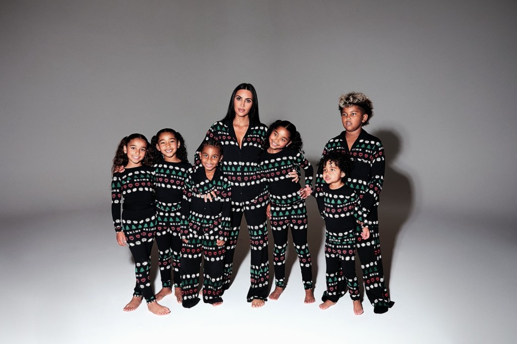 Kim Kardashian poses with her kids and nieces in matching black Christmas pajamas; North is not pictured.