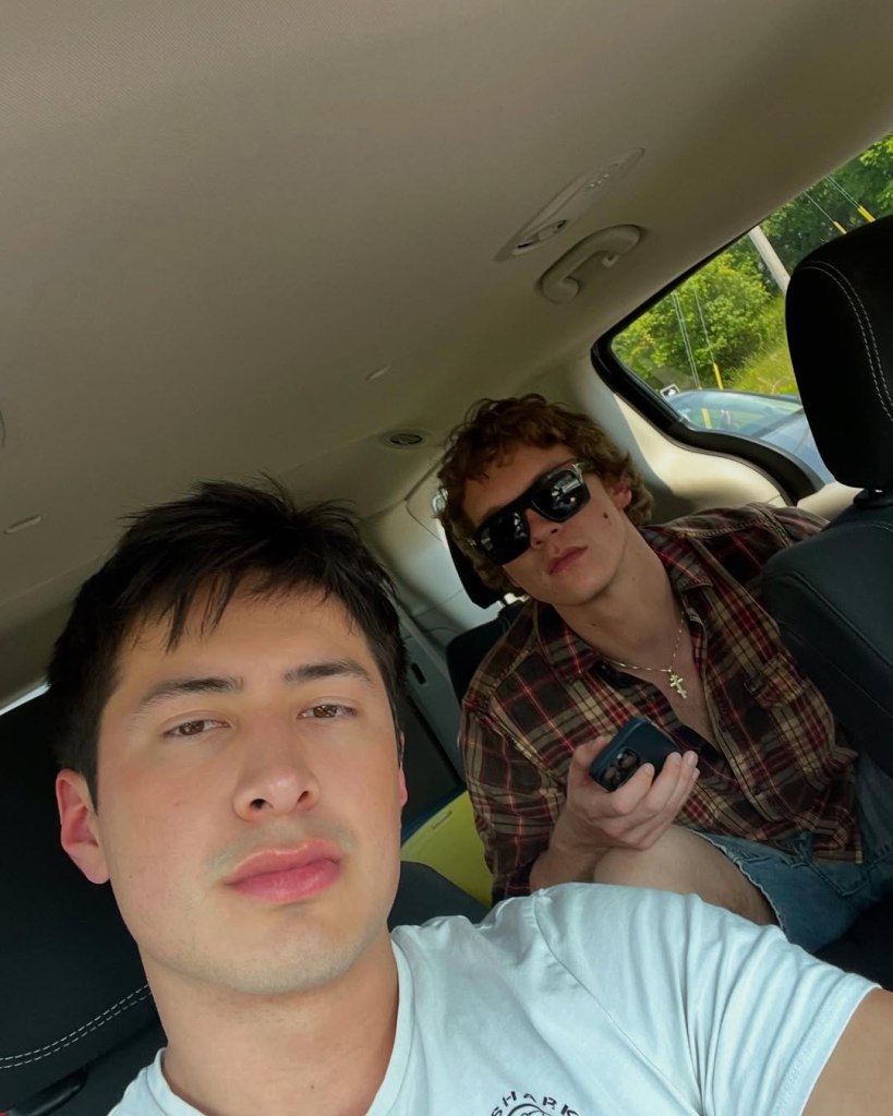 Hudson Williams and Connor Storrie in a car selfie.