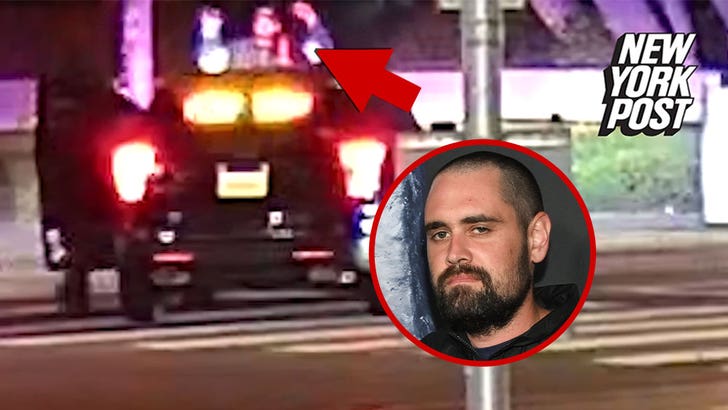 Surveillance still reportedly showing Nick Reiner being detained by LAPD near USC as multiple cruisers arrive.