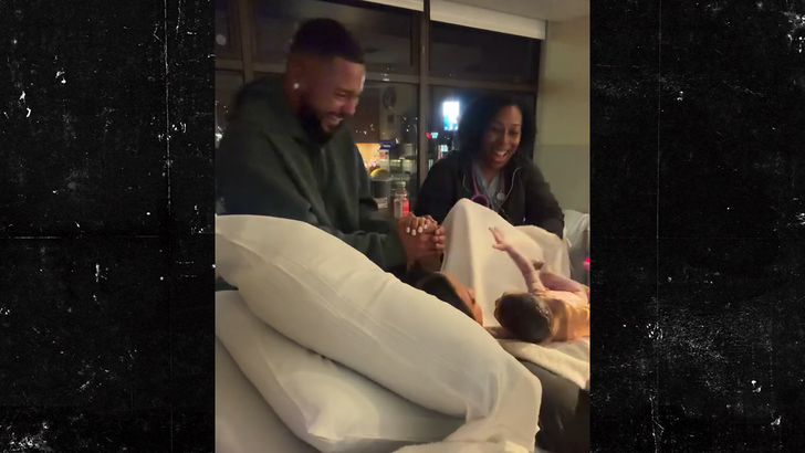 Screenshot from Cheyenne Floyd Davis's Instagram birth video showing her in the delivery room, with husband Zach Davis at the foot of the bed.