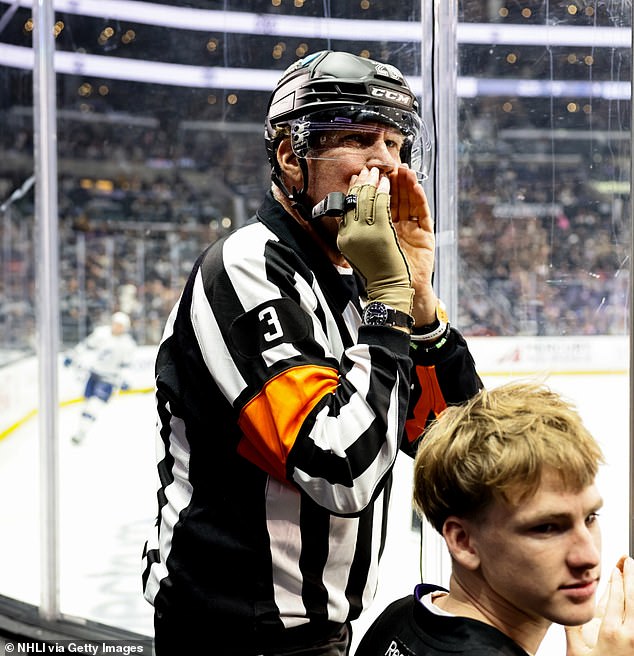 Will Ferrell sits rinkside at Crypto.com Arena dressed in full NHL referee uniform during the LA Kings' New Year's Day game.