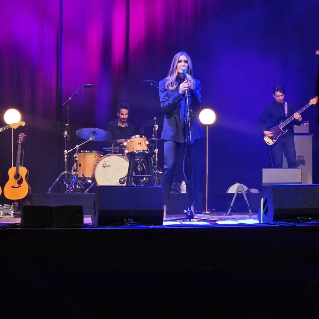 Mandy Moore performing onstage at The Wiltern with her band.