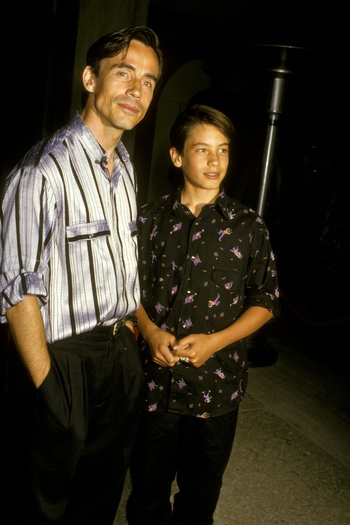 Jackson Browne carries his young son Ethan on his shoulders at a No Nukes concert.