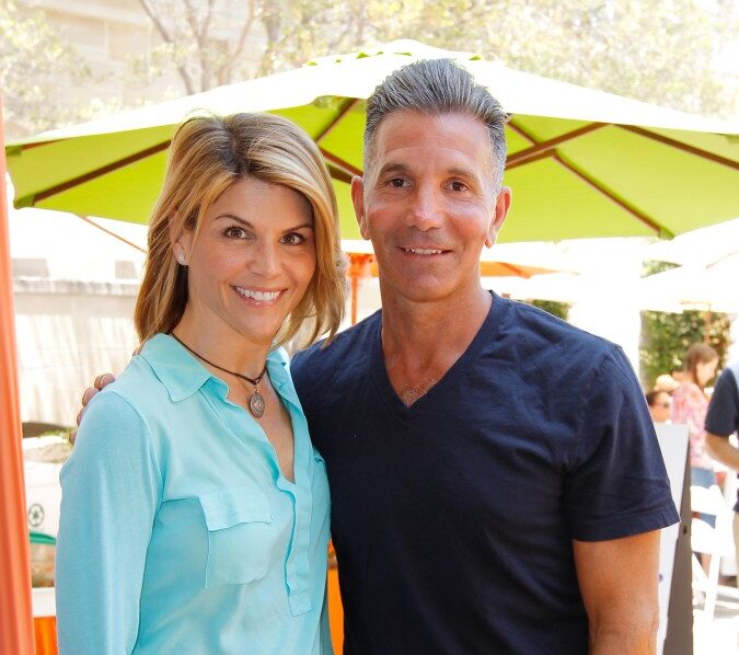 Lori Loughlin and Mossimo Giannulli posing together at the 6th Annual Kidstock Music And Arts Festival.