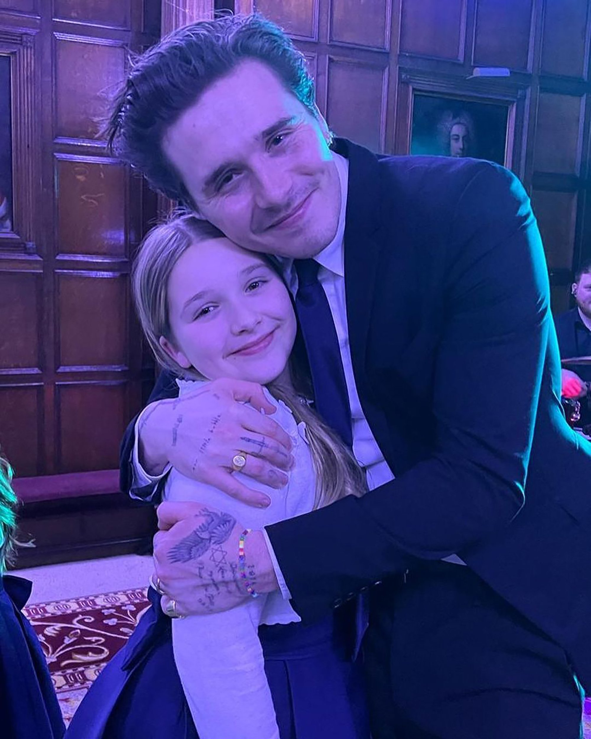 Brooklyn Beckham and Harper Beckham pose together for a photo.