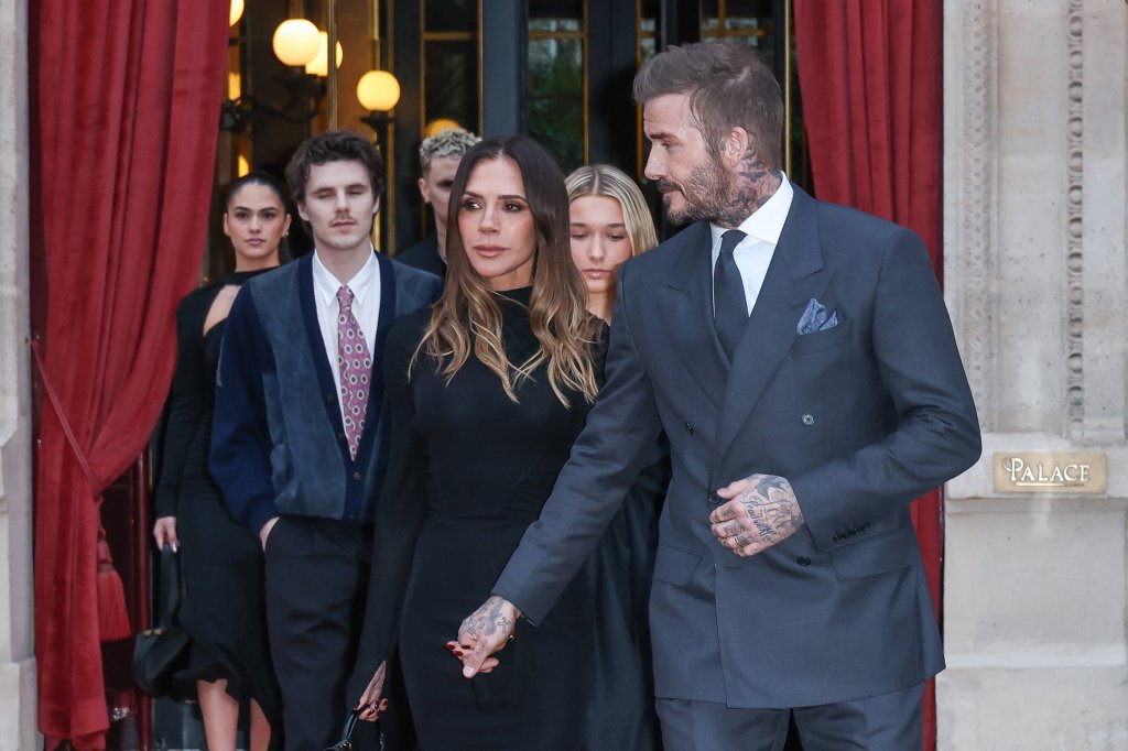David and Victoria Beckham with their family leaving a hotel in Paris amid the public feud.