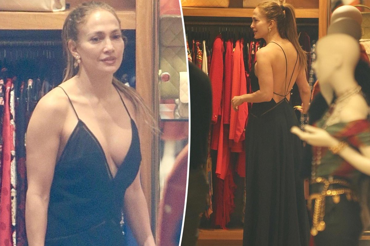 Jennifer Lopez wears a plunging black maxi dress while shopping in Beverly Hills outside vintage boutique What Goes Around Comes Around.