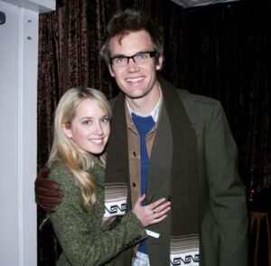 Tyler Hilton and Megan Park embrace at a William Morris party.