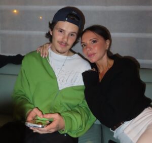Victoria and Cruz Beckham pose together.