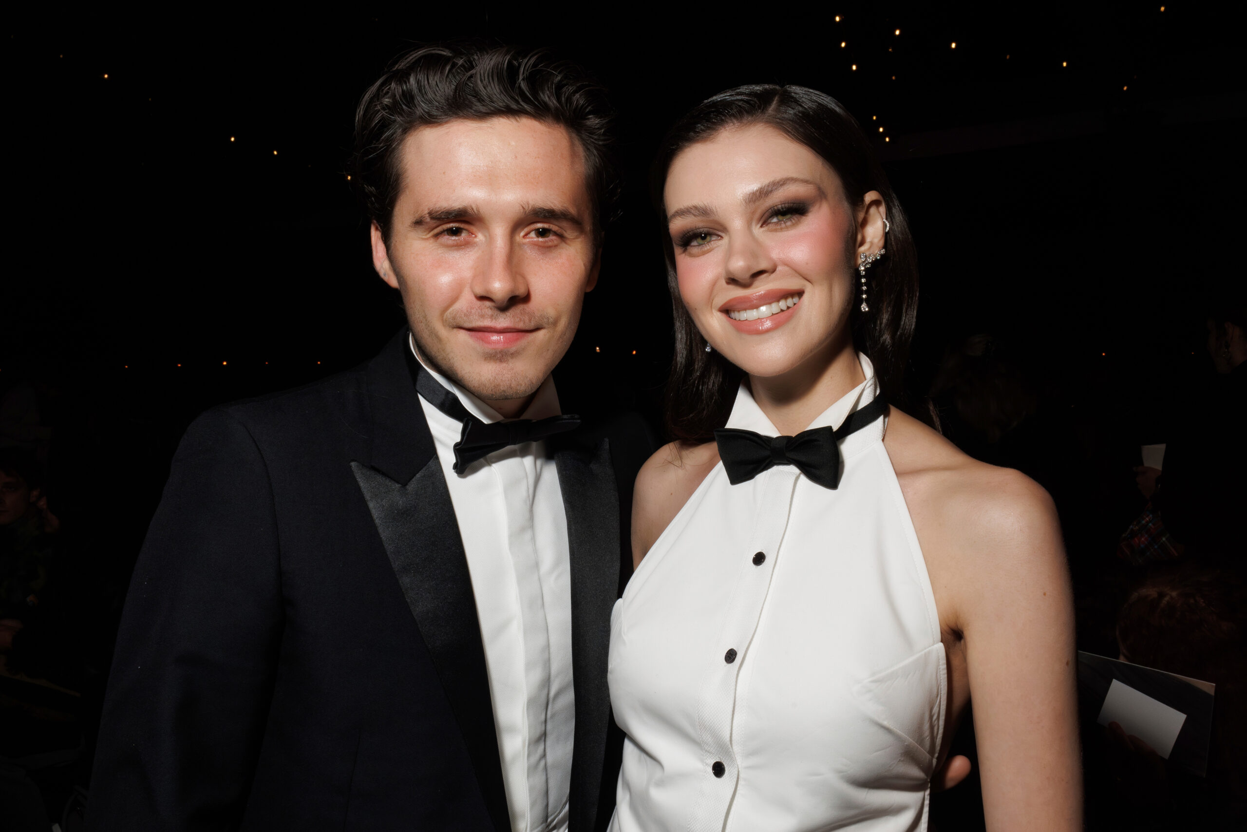 Brooklyn Beckham and Nicola Peltz attend the Victoria Beckham Spring/Summer 2025 collection presented in Paris.