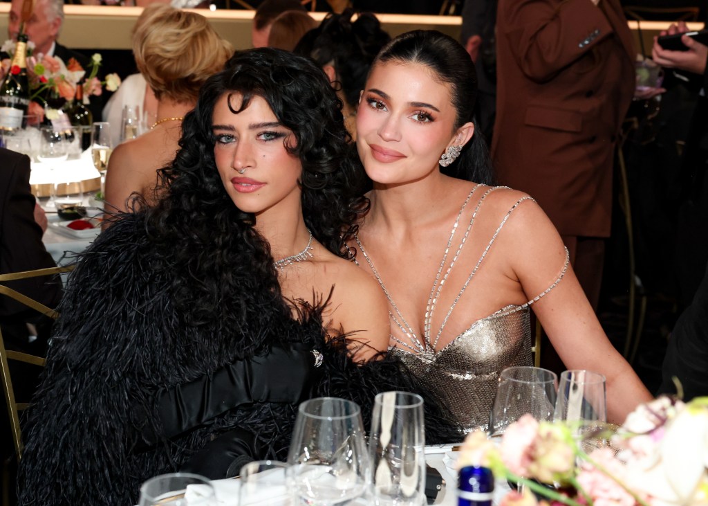 Odessa A'zion appears to bypass Kylie Jenner for an air kiss at the 2026 Golden Globes.