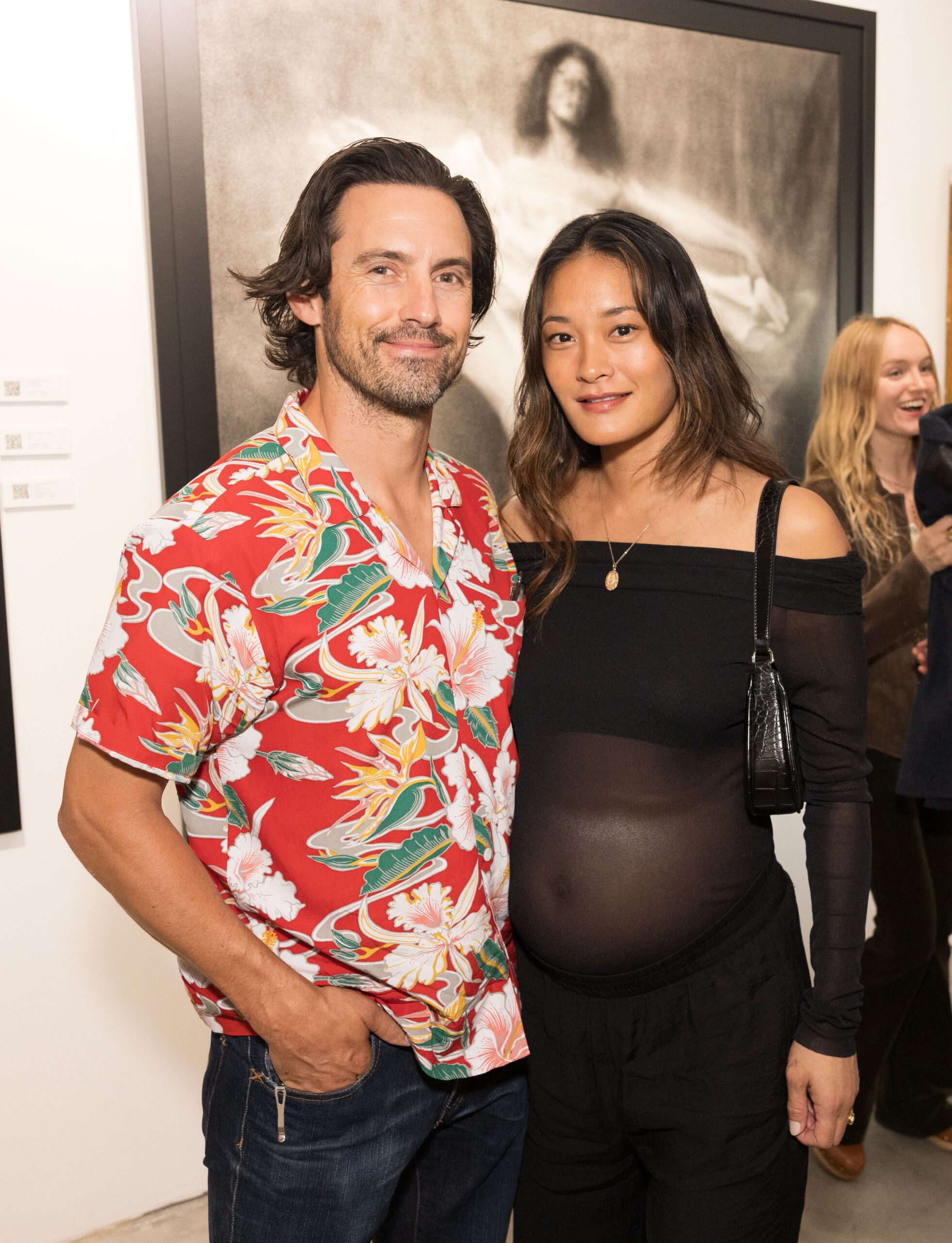 Milo Ventimiglia and Jarah Mariano at the "JOYRIDE" exhibition.