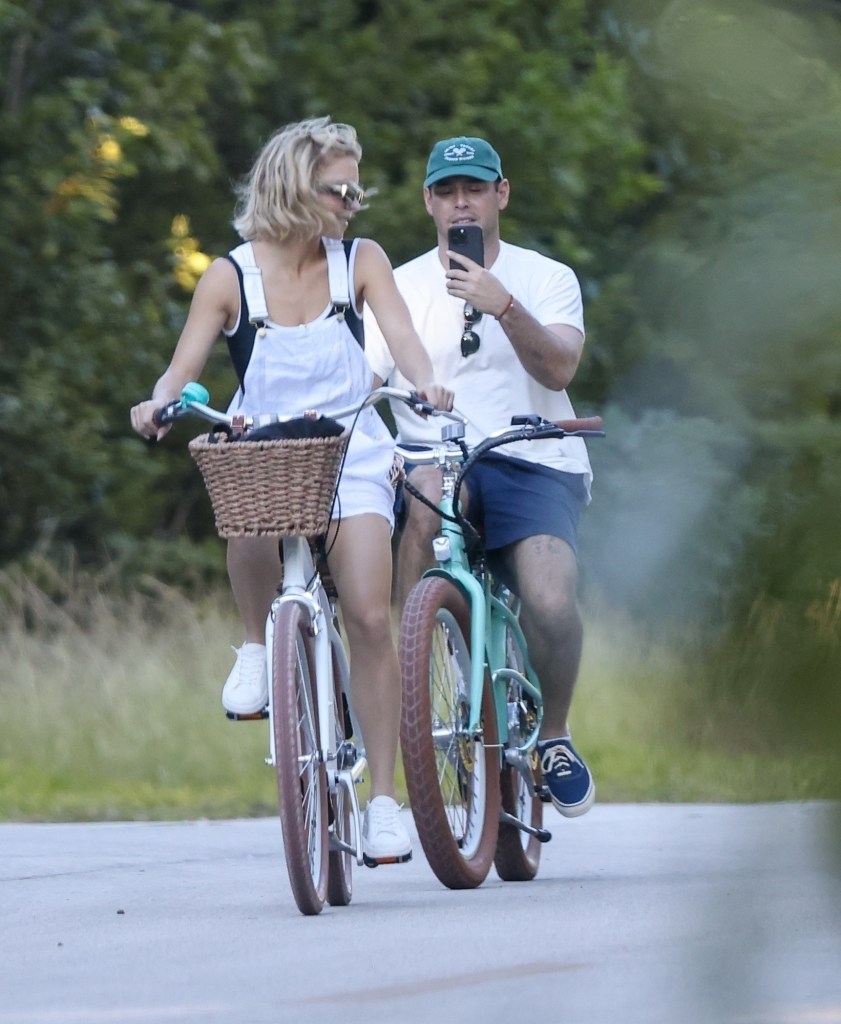 Sydney Sweeney and Scooter Braun bike together.