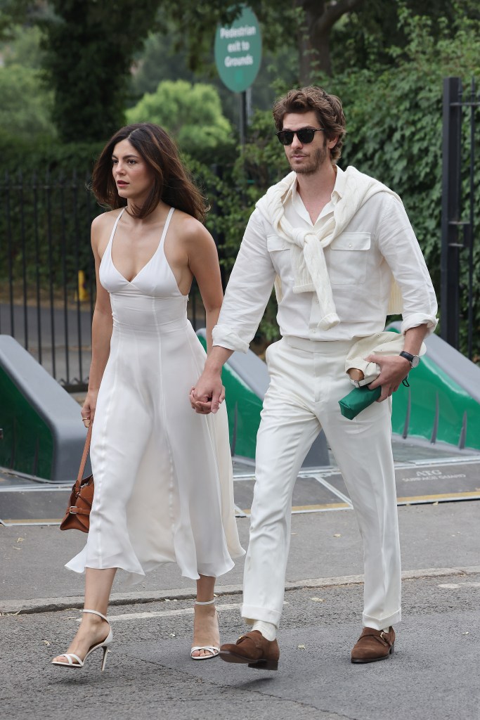Monica Barbaro and Andrew Garfield arrive at the All England Lawn Tennis and Croquet Club during Wimbledon 2025.